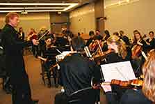 The friction-less collaboration of musicians in an orchestra was used to demonstrate teamwork.